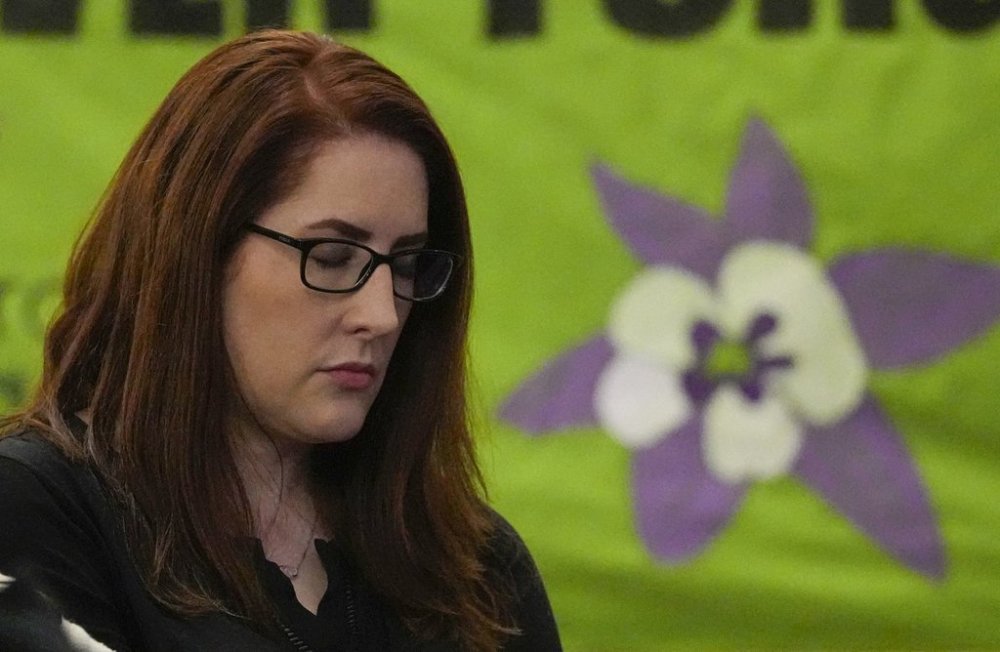 FILE - Columbine High School shooting survivor Anne Marie Hochhalter reacts during a vigil remembering the 25th anniversary of the mass shooting, April 19, 2024, in Denver. (AP Photo/Jack Dempsey, File)
