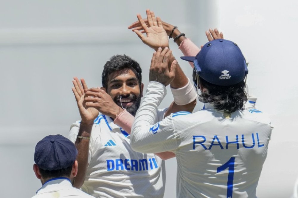 FILE - India's Jasprit Bumrah celebrates with teammates after the wicket of Australia's Mitchell Marsh during play on the day four of the fourth cricket test between Australia and India at the Melbourne Cricket Ground, Melbourne, Australia, Dec. 29, 2024. (AP Photo/Asanka Brendon Ratnayake, File)