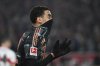 Munich's Jamal Musiala reacts during the German Bundesliga soccer match between Bayern Munich and VfB Stuttgart, at the MHPArena in Stuttgart, Germany, Friday, Feb. 28, 2025. (Marijan Murat/dpa via AP)