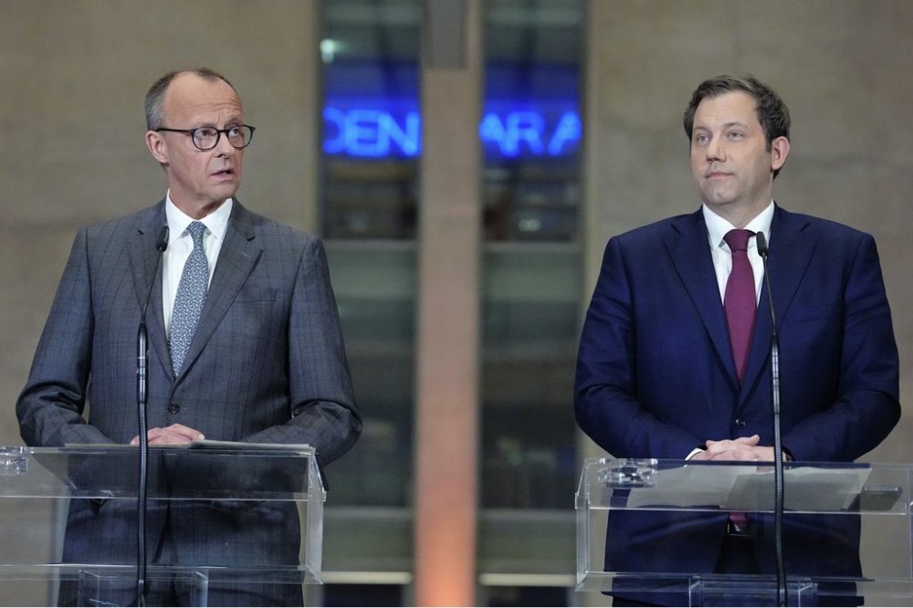 FILE - Friedrich Merz, left, leader of the Christian Democratic Union (CDU) and Lars Klingbeil, co-leader of the Social Democratic Party (SPD) address the media during a press conference in Berlin, Germany, Tuesday, March 4, 2025. (Carsten Koall/dpa via AP, File)
