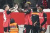 FILE - Leverkusen's Victor Boniface, center, celebrates with his teammates after scoring the third goal against Cologne during the German Cup quarterfinal soccer match between Bayer Leverkusen and FC Cologne at the BayArena in Leverkusen, Germany, on Feb. 5, 2025. (AP Photo/Martin Meissner, File)