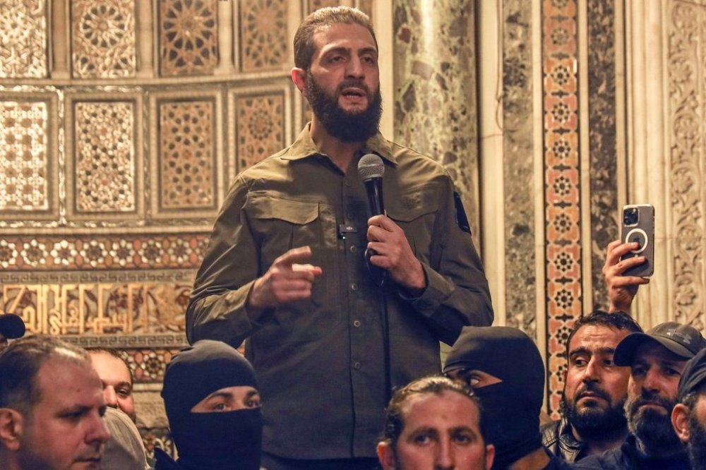 Ahmed al-Sharaa, also known by nom de guerre Abu Mohammed al-Golani, speaks at the Umayyad Mosque in Damascus, Syria, Sunday, Dec. 8, 2024. Prime Minister Justin Trudeau has congratulated Syria's interim president, despite him leading a group Canada designates as a terrorist organization. THE CANADIAN PRESS/AP/Omar Albam