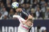 San Diego FC defender Paddy McNair, heads a ball on goal as St. Louis City defender Tomas Totland defends during the second half of an MLS soccer match Saturday, March 1, 2025, in San Diego. (AP Photo/Gregory Bull)