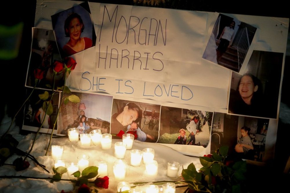 A memorial with photos of Morgan Harris attached is shown as family and friends gather at a vigil in Winnipeg, Thursday, Dec. 1, 2022. Remains found in a Winnipeg-area landfill have been identified as Harris. THE CANADIAN PRESS/John Woods