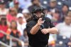 FILE - Home plate umpire Jen Pawol calls a strike during the third inning of a spring training baseball game between the Miami Marlins and Houston Astros Sunday, March 10, 2024, in West Palm Beach, Fla. (AP Photo/Jeff Roberson, File)