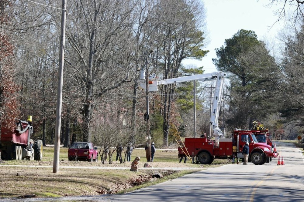 Crews with Tombigbee Electric continue to restore power to homes along Lee County Rd 154 after Saturday's severe weather hit the region in Shannon Miss., Monday, Feb. 17, 2025. (Thomas Wells/The Northeast Mississippi Daily Journal via AP)