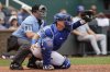 FILE - Kansas City Royals catcher Freddy Fermin (34) takes a pitch as home plate umpire Quinn Wolcott (81) calls the balls and strikes during a baseball game against the Chicago Cubs in Kansas City, Mo., Sunday, July 28, 2024. (AP Photo/Colin E. Braley, File)