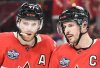 Canada's Connor McDavid (97) and Sidney Crosby talk during third period 4 Nations Face-Off hockey action against the United States in Montreal on February 15, 2025. THE CANADIAN PRESS/Graham Hughes