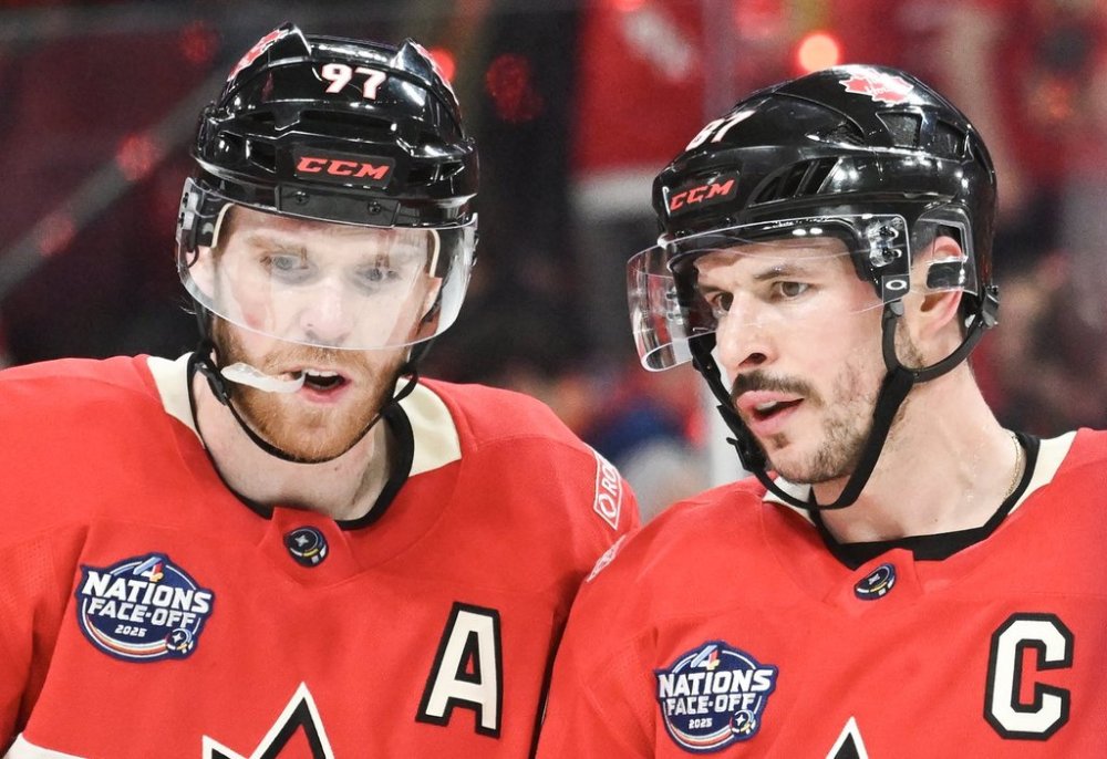 Canada's Connor McDavid (97) and Sidney Crosby talk during third period 4 Nations Face-Off hockey action against the United States in Montreal on February 15, 2025. THE CANADIAN PRESS/Graham Hughes