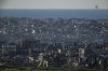 Buildings destroyed during the Israeli air and ground offensive stand in the Gaza Strip are seen from southern Israel, Sunday, March 2, 2025. (AP Photo/Leo Correa)