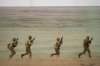 Servicemen run during the Steadfast Dart 2025 exercise, involving some 10,000 troops in three different countries from nine nations, representing the largest NATO operation planned this year, at a training range in Smardan, eastern Romania, Wednesday, Feb. 19, 2025. (AP Photo/Vadim Ghirda)