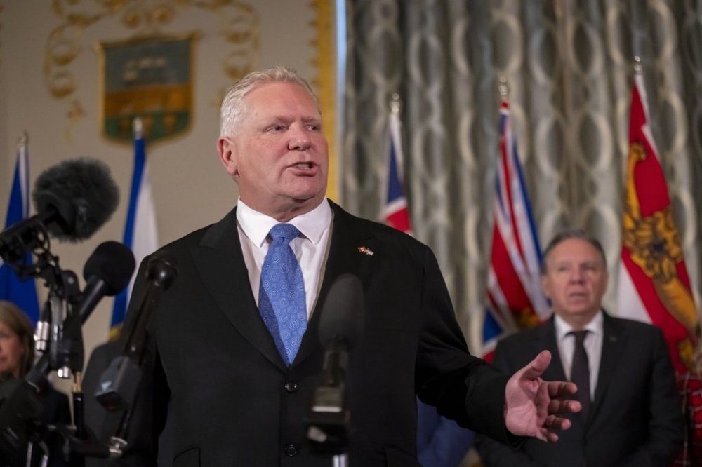 Premier of Ontario Doug Ford speaks to reporters, accompanied by other Council of the Federation members, at the Mayflower Hotel in Washington, Wednesday, Feb. 12, 2025. THE CANADIAN PRESS/AP-Ben Curtis