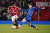 Leicester's Luke Thomas, right, and Manchester United's Amad Diallo challenge for the ball during the English FA Cup fourth round soccer match between Manchester United and Leicester City at the Old Trafford stadium in Manchester, England, Friday, Feb. 7, 2025. (AP Photo/Dave Thompson)