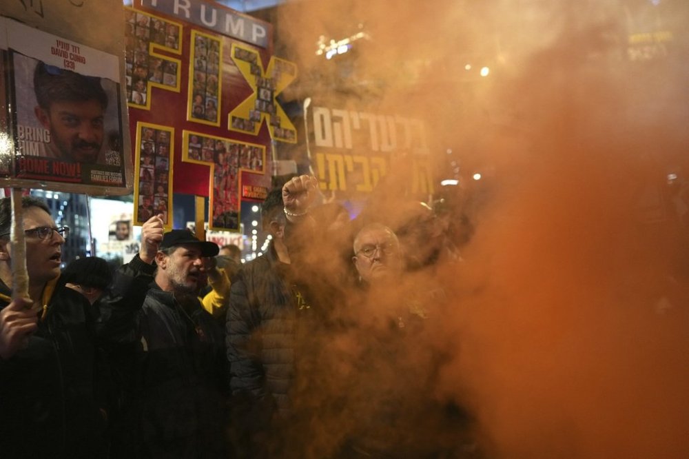 Relatives of hostages, held by Hamas in the Gaza Strip, protest in Tel Aviv, Monday, Feb. 10, 2025 after the militant group announced it would delay hostage releases in the Gaza Strip after accusing Israel of violating a fragile ceasefire. (AP Photo/Ohad Zwigenberg)