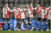 Feyenoord's players celebrate their opening goal, scored by Igor Paixao during the Champions League playoff first leg soccer match between Feyenoord and AC Milan, at the De Kuip stadium, in Rotterdam, Netherlands, Wednesday, Feb. 12, 2025. (AP Photo/Peter Dejong)