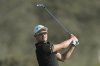 FILE - Li Haotong plays his second shot on the 16th hole during the third round of the Hero Dubai Desert Classic golf tournament, in Dubai, United Arab Emirates, Jan. 20, 2024. (AP Photo/Kamran Jebreili, file)