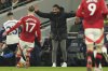 Manchester United's coach Ruben Amorim gestures from the sidelines during the English Premier League soccer match between Tottenham Hotspur and Manchester United in London, Sunday, Feb. 16, 2025. (AP Photo/Ian Walton)
