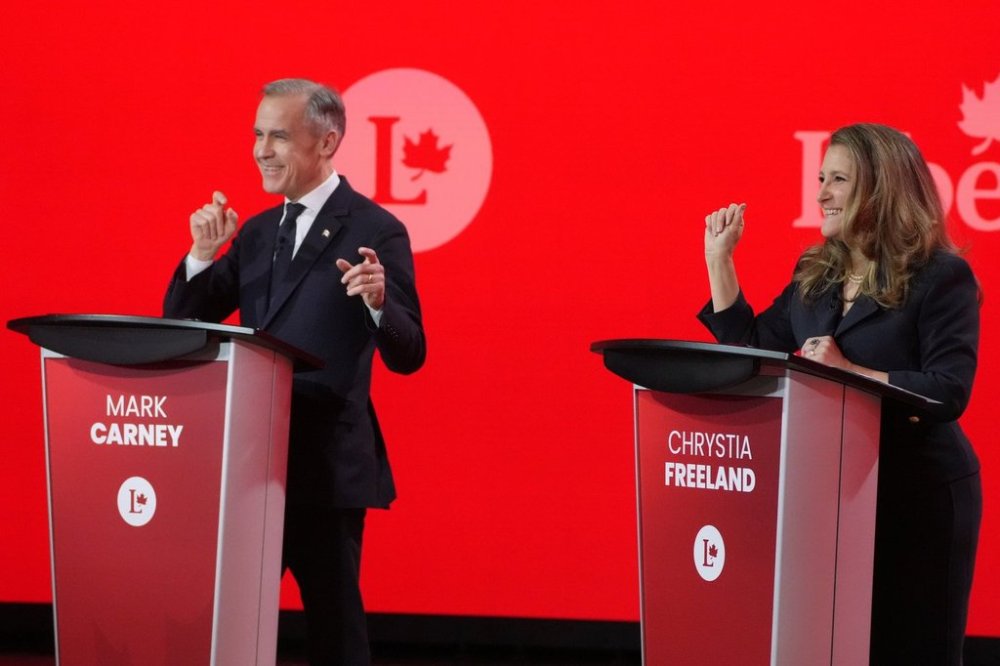 Liberal Party of Canada leadership candidates Mark Carney and Chrystia Freeland share a laugh during the French-language Liberal Leadership debate in Montreal, Monday, Feb. 24, 2025. The federal Liberals will pick a new leader on March 9. THE CANADIAN PRESS/Christinne Muschi