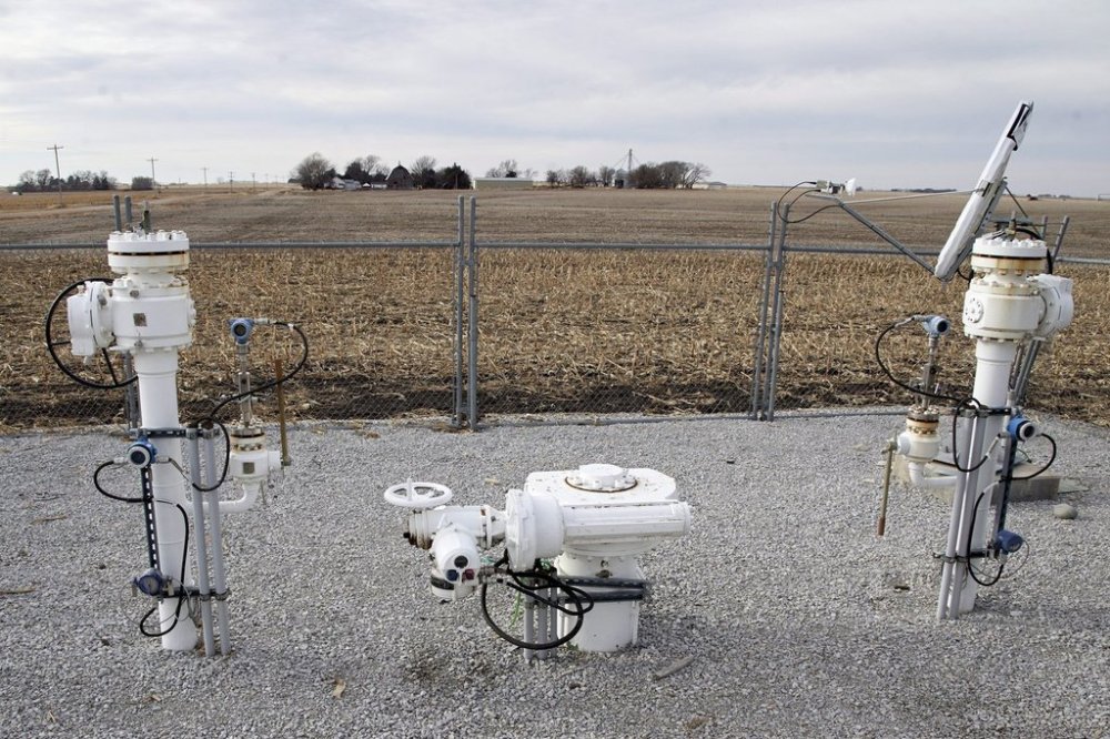U.S. President Donald Trump says he'd like to see the Keystone XL pipeline brought back from the dead, garnering an enthusiastic reception from Alberta's premier but a tepid one from the company spun off from its erstwhile proponent. A Keystone pipeline pumping station is surrounded by corn fields in rural Milford, Neb., Thursday, Jan. 9, 2020. THE CANADIAN PRESS/AP/Nati Harnik