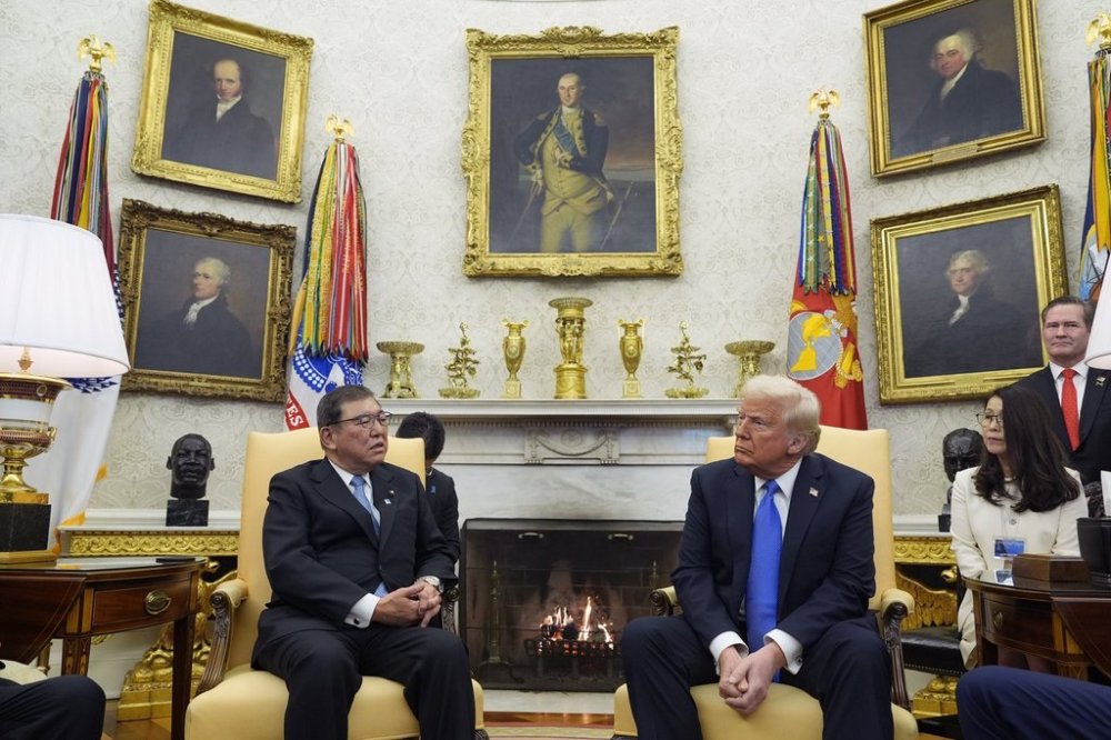 President Donald Trump speaks with Japanese Prime Minister Shigeru Ishiba in the Oval Office of the White House, Friday, Feb. 7, 2025, in Washington. (AP Photo/Alex Brandon)