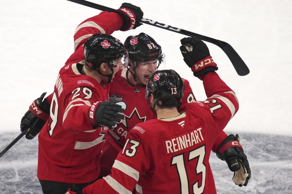 Canada's Sidney Crosby, centre, celebrates after his goal against Finland during the third period of a 4 Nations Face-Off hockey game, Monday, Feb. 17, 2025, in Boston. THE CANADIAN PRESS/AP-Charles Krupa
