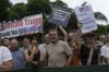 White South Africans demonstrate in support of U.S. President Donald Trump in front of the U.S. embassy in Pretoria, South Africa, Saturday, Feb. 15, 2025. (AP Photo/Jerome Delay)