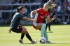 FILE - Kansas City Current midfielder Claire Hutton, right, tries to dribble around Portland Thorns FC midfielder Jessie Fleming, left, during an NWSL soccer match at CPKC Stadium, Saturday, March 16, 2024, in Kansas City, Mo. (AP Photo/Reed Hoffmann, File)