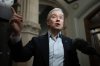 Industry Minister Francois-Philippe Champagne speaks with reporters as he makes his way to caucus on Parliament Hill, Friday, Jan. 24, 2025 in Ottawa. Champagne is looking to block what he calls an opportunity for 