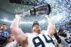 Toronto Argonauts' Jake Ceresna (94) lifts the Grey Cup after defeating the Winnipeg Blue Bombers in CFL football action at the 111th Grey Cup in Vancouver on Sunday, Nov. 17, 2024. THE CANADIAN PRESS/Nathan Denette