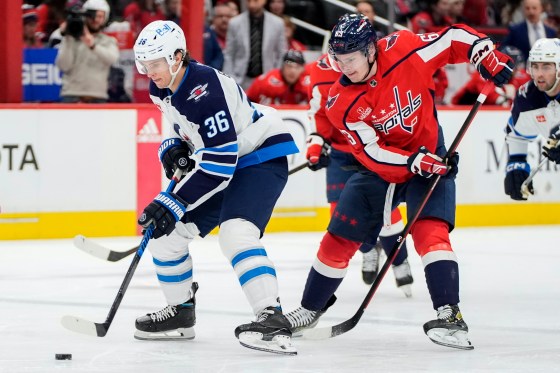 Winnipeg Jets centre Morgan Barron (36) takes the puck ahead of Washington Capitals left wing Ivan Miroshnichenko (63) during a game last season. (Mark Schiefelbein / Associated Press files)