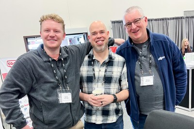 Employees at Arctic Co-operatives Limited attend a trade show together.
