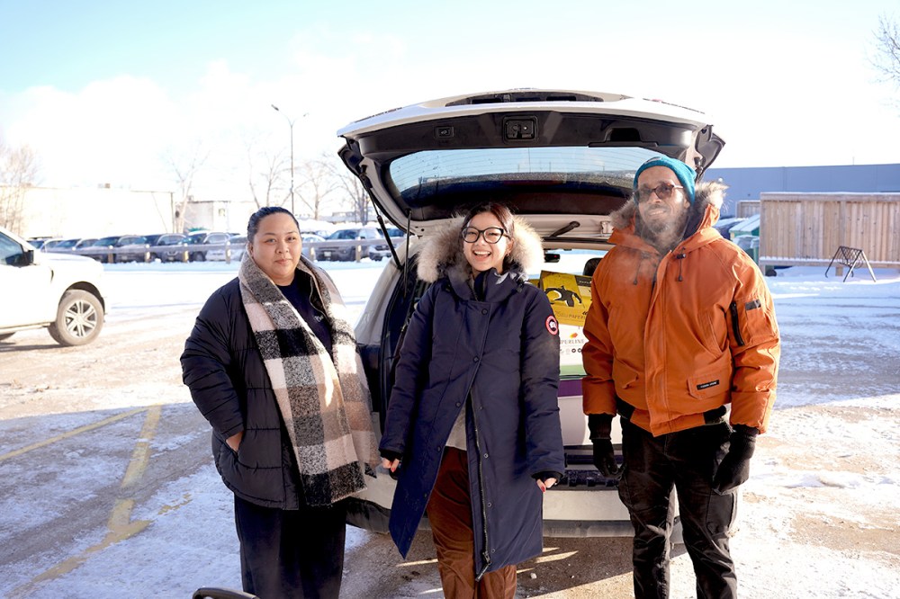 Employees at Johnston Group deliver Christmas Cheer hampers.