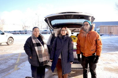 Employees at Johnston Group deliver Christmas Cheer hampers.
