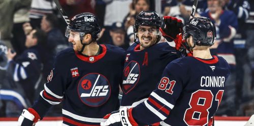 Winnipeg Jets' Gabriel Vilardi (13), Mark Scheifele (55) and Kyle Connor (81) celebrate Vilardi's goal against the New York Islanders during second period NHL action in Winnipeg on Friday, February 7, 2025. THE CANADIAN PRESS/John Woods