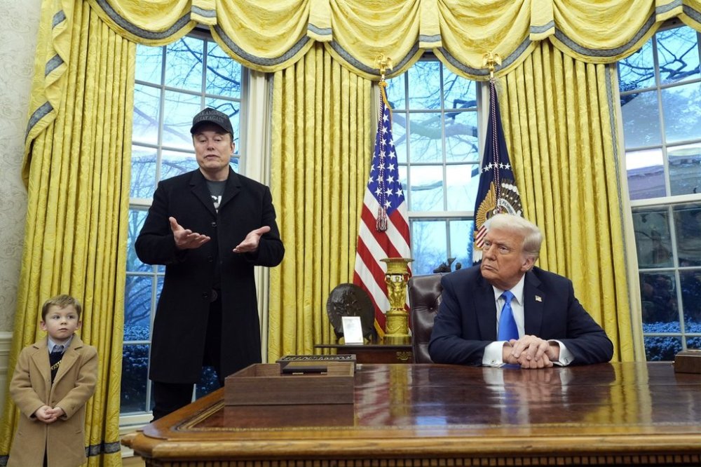 President Donald Trump listens as Elon Musk, joined by his son X Æ A-Xii, speaks in the Oval Office at the White House, Tuesday, Feb. 11, 2025, in Washington. (Photo/Alex Brandon)