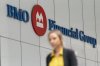 A person makes their way past the Bank of Montreal (BMO) building in the Financial District of Toronto, on Monday, Aug. 14, 2023. THE CANADIAN PRESS/Spencer Colby