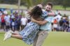 Brian Campbell, of the United States, embraces his girlfriend Kelsi McKee after winning the Mexico Open golf tournament in Puerto Vallarta, Mexico, Sunday, Feb. 23, 2025. (AP Photo/Fernando Llano)