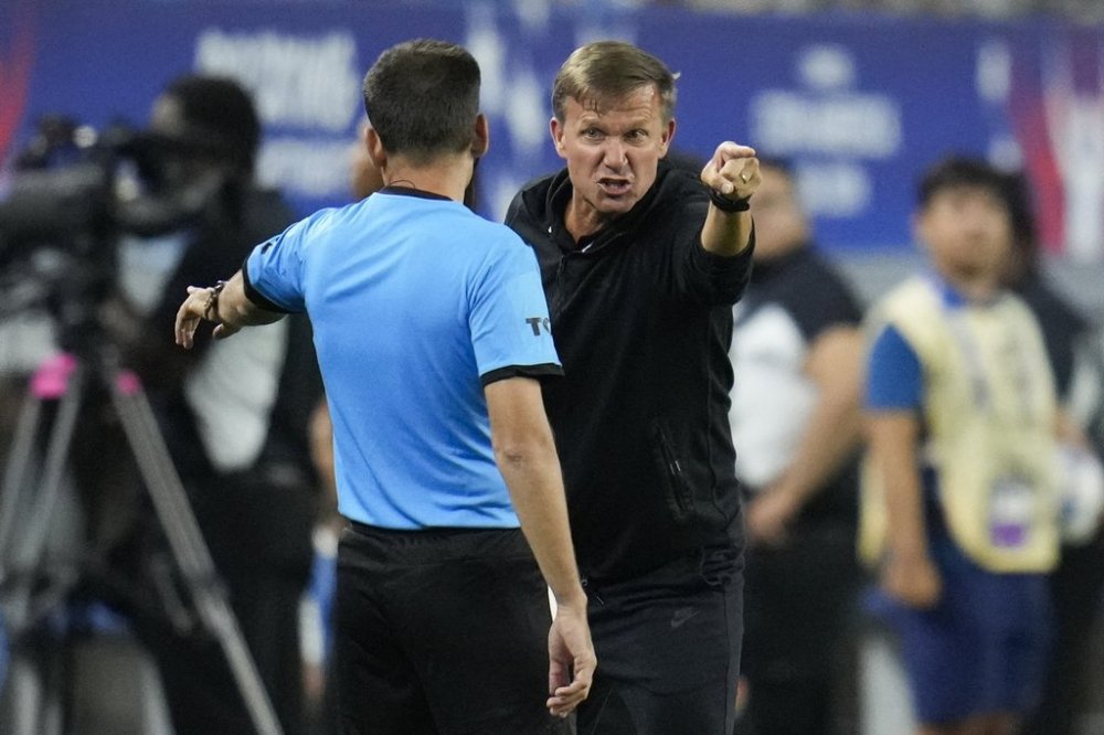 Canada head coach Jesse Marsch, right, disputes a call during a Copa America quarterfinal soccer match between Venezuela and Canada, Friday, July 5, 2024, in Arlington, Texas. Marsch waded into politics Wednesday, telling President Donald Trump