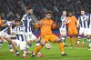 Real Sociedad's Brais Mendez, centre left, challenges for the ball with Real Madrid's Raul Asencio during the Spanish Copa del Rey soccer match between Real Sociedad and Real Madrid at the Reale Arena in San Sebastian, Spain, Wednesday, Feb. 26, 2025. (AP Photo/Miguel Oses)