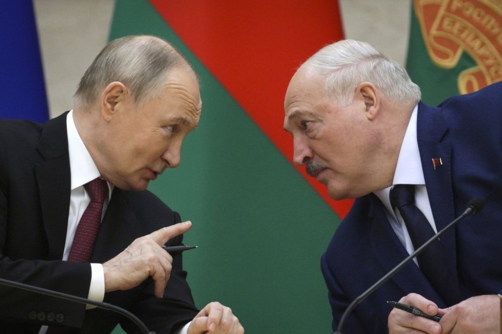 FILE - Russian President Vladimir Putin, left, and Belarusian President Alexander Lukashenko talk during a signing ceremony in Minsk, Belarus, Dec. 6, 2024. (Gavriil Grigorov, Sputnik, Kremlin Pool Photo via AP, File)