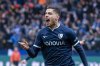 Bochum's Georgios Masouras celebrates after scoring his side's second goal during the German Bundesliga soccer match between VfL Bochum and Borussia Dortmund in Bochum, Germany, Saturday, Feb. 15, 2025. (David Inderlied/dpa via AP)