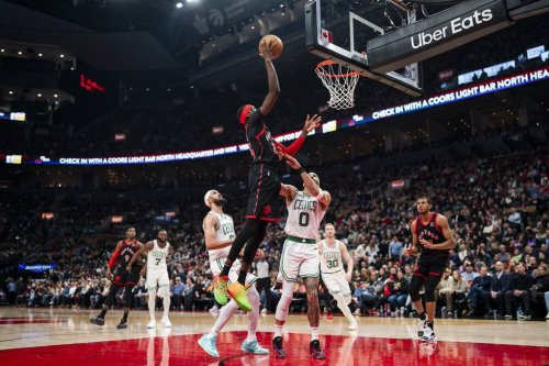 Toronto Raptors forward Chris Boucher (25) drives to the net as Boston Celtics forward Jayson Tatum (0) defends during the first half of NBA basketball action in Toronto on Tuesday, February 25, 2025. THE CANADIAN PRESS/Thomas Skrlj