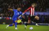 Leicester City's Jordan Ayew, left, and Brentford's Kristoffer Ajer battle for the ball during the English Premier League soccer match at the King Power Stadium, Leicester, England, Friday Feb. 21, 2025. (Mike Egerton/PA via AP)