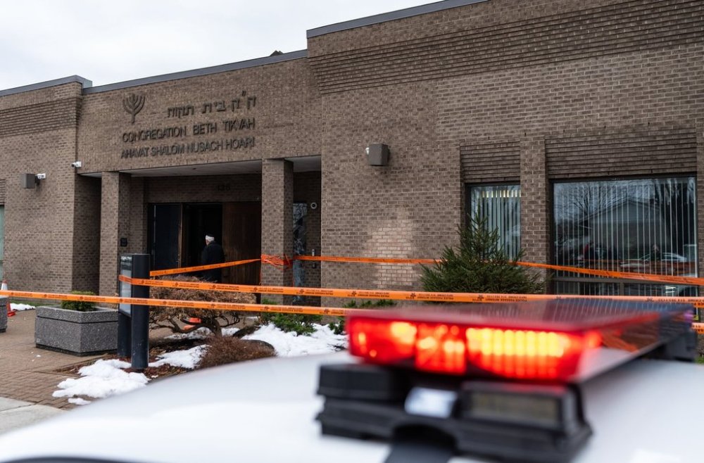 A police car sits outside Congregation Beth Tikvah as police investigate alleged arson at the synagogue in the suburb of Dollard-des-Ormeaux in Montreal on Wednesday, Dec.18, 2024. THE CANADIAN PRESS/Christinne Muschi