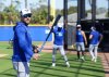 Former Toronto Blue Jays outfielder Kevin Kiermaier, now a special assistant with the team, works with players at spring training in Dunedin Fla., on Friday, Feb. 14, 2025. THE CANADIAN PRESS/Nathan Denette