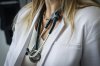 A strike by 7,000 health care workers in Manitoba that was supposed to start today has been called off, at least for the time being. A doctor wears a lab coat and stethoscope in an exam room at a health clinic in Calgary, Friday, July 14, 2023.THE CANADIAN PRESS/Jeff McIntosh