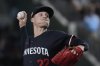 FILE - Minnesota Twins pitcher Griffin Jax throws during a baseball game against the Texas Rangers in Arlington, Texas, Aug. 16, 2024. (AP Photo/LM Otero, File)