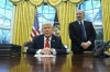 President Donald Trump speaks with reporters as he signs an executive order in the Oval Office at the White House, Monday, Feb. 10, 2025, in Washington. As Commerce Secretary nominee Howard Lutnick listens. (Photo/Alex Brandon)
