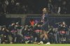 PSG's Bradley Barcola celebrates after scoring the opening goal of his team against Brest during the Champions League playoff second leg soccer match between Paris Saint-Germain and Brest at the Parc des Princes in Paris, Wednesday, Feb. 19, 2025. (AP Photo/Michel Euler)
