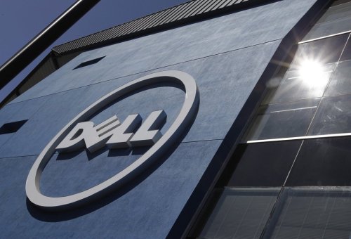 In this Aug. 21, 2012 file photo, the sun is reflected in the exterior of Dell Inc.'s offices in Santa Clara, Calif. (AP Photo/Paul Sakuma, File)